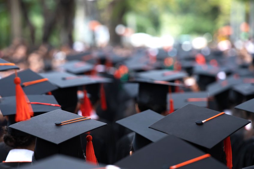 Graduates wearing mortarboards at a commencement ceremony