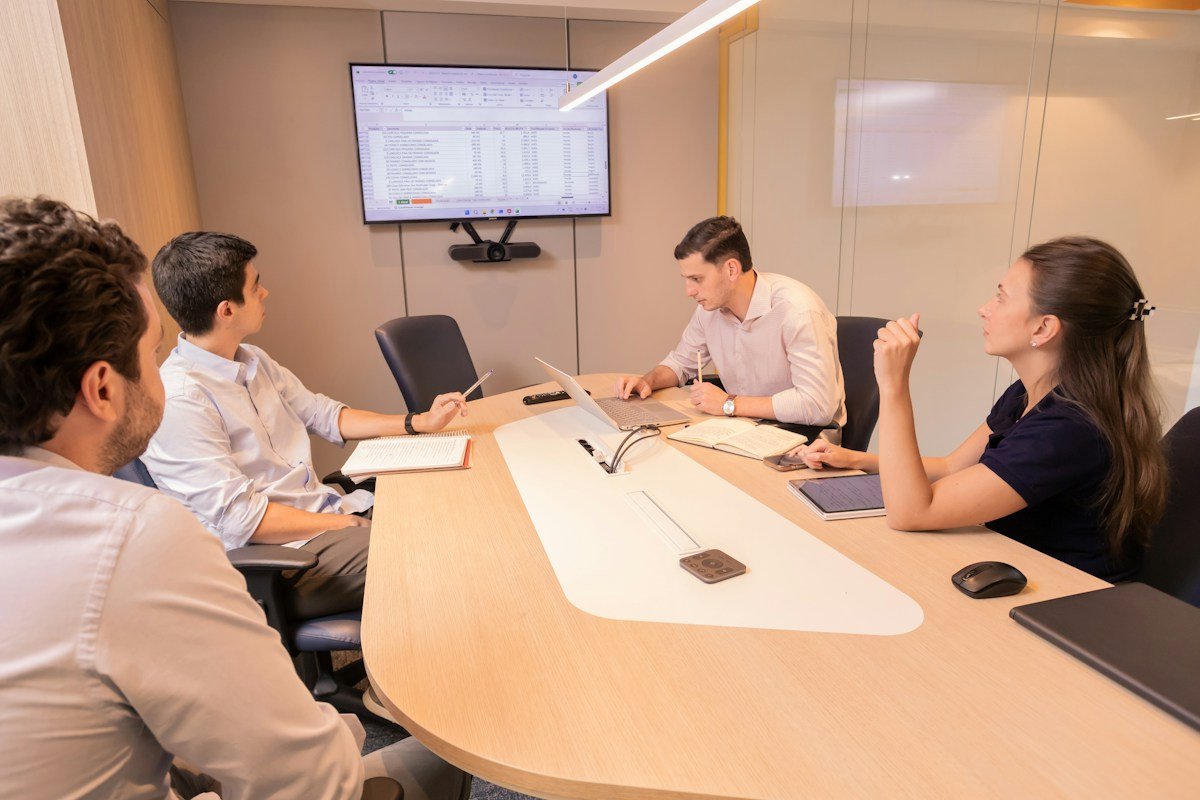 Professionals collaborating around a conference table